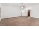 Bright living room features tile flooring and a ceiling fan at 14404 N 56Th Pl, Scottsdale, AZ 85254