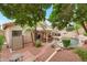 Lush backyard with a well-maintained pool, covered patio, and lovely landscaping at 14447 N 100Th Way, Scottsdale, AZ 85260