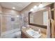 Bathroom featuring neutral tones, single vanity, and shower-tub combo at 14447 N 100Th Way, Scottsdale, AZ 85260