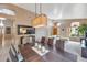 Dining room with modern chandelier and view into the living area at 14447 N 100Th Way, Scottsdale, AZ 85260