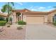 Charming home featuring a tile roof, a large driveway, and desert landscaping at 14447 N 100Th Way, Scottsdale, AZ 85260