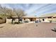 Spacious backyard with desert landscaping, covered patio, and outdoor seating area at 14545 S Cherry Hills Dr, Arizona City, AZ 85123