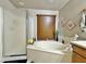 Relaxing bathroom showcasing a tub, frosted glass shower, and decorative accents at 14545 S Cherry Hills Dr, Arizona City, AZ 85123