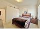 Comfortable bedroom featuring a cozy bed with unique quilt, light walls, and dark wood furnishings at 14545 S Cherry Hills Dr, Arizona City, AZ 85123