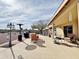 Expansive covered patio with dining and seating areas, ideal for entertaining and enjoying the outdoors at 14545 S Cherry Hills Dr, Arizona City, AZ 85123