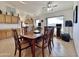 Dining area featuring tile floors, wood table with seating, and a ceiling fan for comfort at 14545 S Cherry Hills Dr, Arizona City, AZ 85123