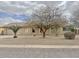 Inviting single-story home featuring a well-kept yard and tile roof at 14545 S Cherry Hills Dr, Arizona City, AZ 85123