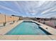 Inviting rectangular pool with stylish desert landscaping and clear blue water for summer fun at 14545 S Cherry Hills Dr, Arizona City, AZ 85123