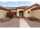 Charming home featuring with desert landscaping, bench, and covered entrance at 15924 W Falcon Ridge Dr, Sun City West, AZ 85375