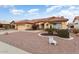 Charming home featuring a two-car garage, front yard desert landscaping, and a welcoming front entrance at 15924 W Falcon Ridge Dr, Sun City West, AZ 85375