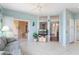 Bright living room featuring tile floors, ample natural light, and comfortable seating at 15924 W Falcon Ridge Dr, Sun City West, AZ 85375