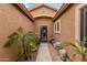 Inviting front entrance with charming desert landscape and decorative accents at 16830 S Coleman St, Phoenix, AZ 85045