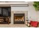 Cozy fireplace with a stone surround and decorative accents adds warmth and charm to the living space at 16830 S Coleman St, Phoenix, AZ 85045