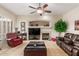 Bright living room features neutral tones, a fireplace, and comfortable seating at 16830 S Coleman St, Phoenix, AZ 85045