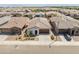 Aerial view showcasing a single-Gathering home with desert landscaping and a two-car garage at 17055 W El Caminito Dr, Waddell, AZ 85355