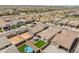 Aerial view of a community, this backyard features turf, pool, and patio at 17055 W El Caminito Dr, Waddell, AZ 85355