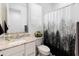 Modern bathroom with neutral tones, decorative accents, and granite countertops at 17055 W El Caminito Dr, Waddell, AZ 85355