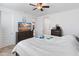 Primary bedroom with a view of a TV on a dresser and a neutral color scheme at 17055 W El Caminito Dr, Waddell, AZ 85355