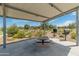 Covered picnic area with a grill perfect for community gatherings and outdoor meals at 17055 W El Caminito Dr, Waddell, AZ 85355