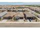 Charming single-story home featuring desert landscaping, neutral color palette, and tile roofing in a Gathering-friendly neighborhood at 17055 W El Caminito Dr, Waddell, AZ 85355