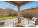 Backyard with a seating area and mountain views at 1743 W Flintlock Dr, San Tan Valley, AZ 85144