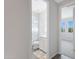 Cozy bathroom view, with a polka dot shower curtain, white vanity, and a colorful rug on the neutral flooring at 1743 W Flintlock Dr, San Tan Valley, AZ 85144