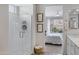 Bright bathroom with walk-in shower, neutral tones, and natural light offering a spa-like experience at 1743 W Flintlock Dr, San Tan Valley, AZ 85144