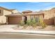 Inviting home with a well-manicured front yard, neutral exterior, and a two-car garage with concrete driveway at 1743 W Flintlock Dr, San Tan Valley, AZ 85144