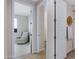 Hallway view showing the entrance to a sitting room and a white paneled door at 1743 W Flintlock Dr, San Tan Valley, AZ 85144