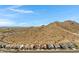 Panoramic view showcasing a desert neighborhood with mountain views and a clear, blue sky backdrop at 1743 W Flintlock Dr, San Tan Valley, AZ 85144