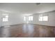 Bright, airy living room with tile floors and large windows offering plenty of natural light at 18432 W Mohave St, Goodyear, AZ 85338