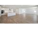 Spacious living room with tile floors, recessed lighting, and ample natural light creating an inviting atmosphere at 18432 W Mohave St, Goodyear, AZ 85338