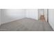 Bedroom featuring carpeted floors, a closet, and a white door at 18444 W Mohave St, Goodyear, AZ 85338