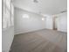 Comfortable bedroom featuring neutral carpeting, a ceiling fan, and natural light from multiple windows at 18444 W Mohave St, Goodyear, AZ 85338