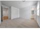 Spacious bedroom with a carpeted floor, closet, and ensuite bathroom at 18444 W Mohave St, Goodyear, AZ 85338