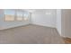Serene bedroom with neutral carpeting, multiple windows, and ample natural light for a calm space at 18444 W Mohave St, Goodyear, AZ 85338