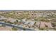 Aerial view of a community showcasing a home with lush landscaping, sparkling pool, and inviting outdoor spaces at 19318 E Walnut Rd, Queen Creek, AZ 85142