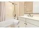 Well-lit bathroom with shower-tub combo and vanity with bronze hardware at 19318 E Walnut Rd, Queen Creek, AZ 85142