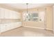 Dining area with ample counter space, storage, and view from three windows at 19318 E Walnut Rd, Queen Creek, AZ 85142