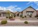 Beautiful single-story home featuring a stone facade, tile roof, and professionally landscaped front yard at 19318 E Walnut Rd, Queen Creek, AZ 85142