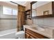 Cozy bathroom featuring a vanity, mirror, and bathtub with a decorative curtain at 1975 E Sunburst Ln, Tempe, AZ 85284