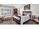 Cozy bedroom featuring a decorative wooden dresser, comfortable sleigh bed, and stylish plantation shutters at 1975 E Sunburst Ln, Tempe, AZ 85284