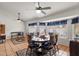 Open-concept dining area with large windows providing natural light, and comfortable seating for six people at 1975 E Sunburst Ln, Tempe, AZ 85284