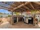 Outdoor kitchen featuring a stainless steel grill, mini refrigerator, and stone countertop, great for outdoor cooking at 1975 E Sunburst Ln, Tempe, AZ 85284