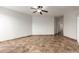 Spacious bedroom featuring neutral walls, tile flooring, and a ceiling fan for added comfort at 20212 N Valencia Dr, Maricopa, AZ 85138