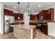 Well-appointed kitchen featuring an island with a sink, stainless steel appliances, and ample cabinetry at 20212 N Valencia Dr, Maricopa, AZ 85138