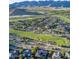 An aerial view of the community showcases the golf course, mountain views, and desert landscaping at 20524 W Nelson Pl, Buckeye, AZ 85396