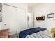 Well-organized bedroom with large closets, neutral walls, and a striped bedspread at 20524 W Nelson Pl, Buckeye, AZ 85396