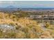 Picturesque community view featuring desert landscaping and city views in the distance at 20524 W Nelson Pl, Buckeye, AZ 85396