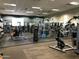 Well-equipped gym featuring free weights, weight machines, and mirrored walls at 20524 W Nelson Pl, Buckeye, AZ 85396